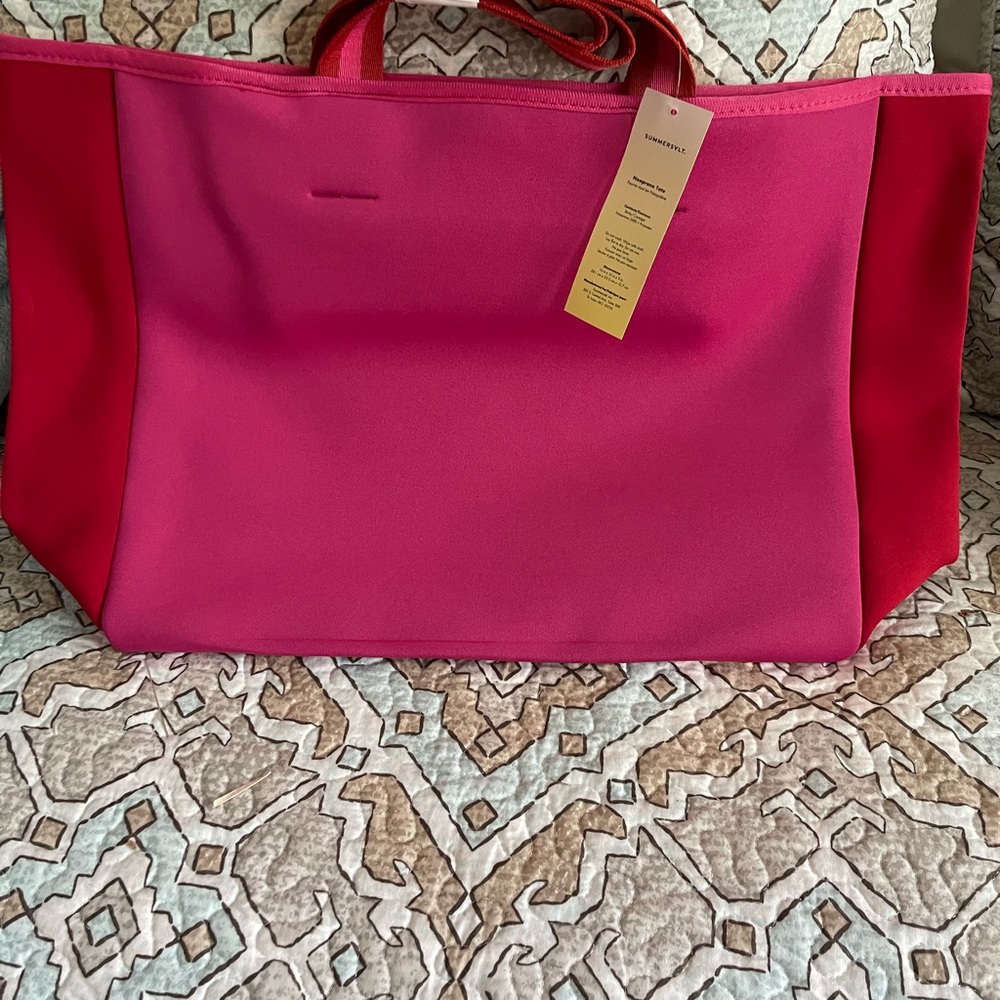 Somersault neoprene tote. Hot pink and red accents. New with tags.